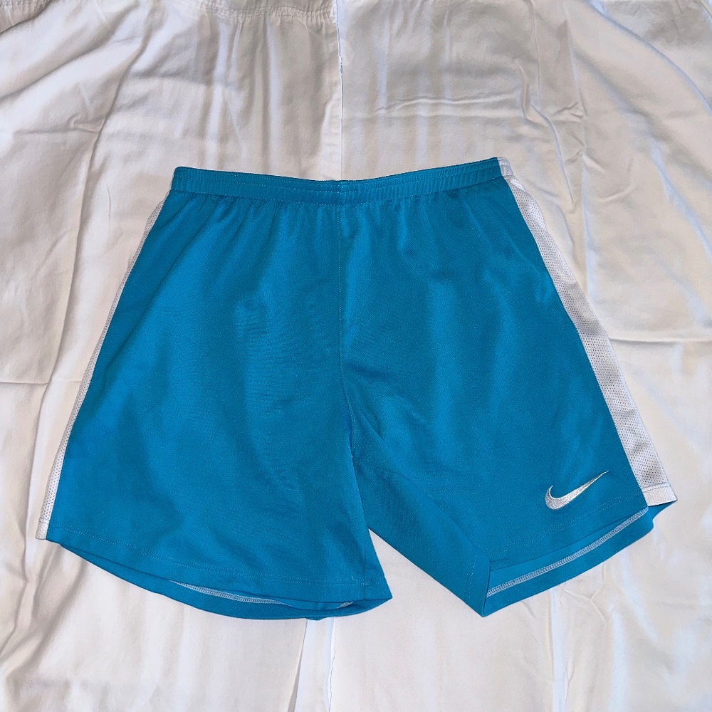 Nike Girl’s shorts. Light blue with white stripe. Size XL.  Used.
